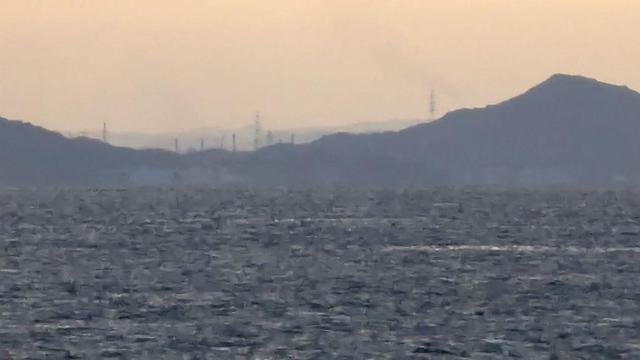 A close up from the previous picture. There are a lot of factory chimneys on the horizon.