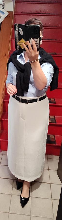 Crisp blue button up, white column skirt. Black sweater as scarf, black belt, black slingbacks. Gold jewelry.