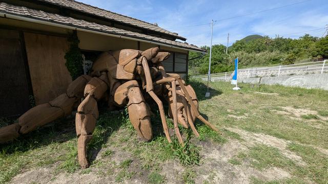 The sculpture of a hermit crab, except that instead of a shell, it's a house. An actual house, as if it was a giant hermit crab that had decided to use it as its shell.