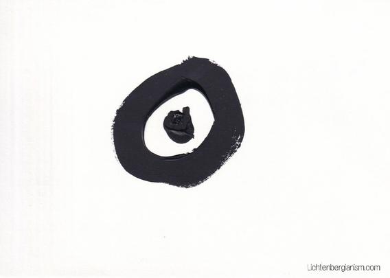 On a white card, a heavy black painted circle with a black dot in the center.