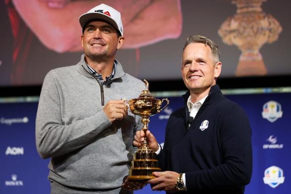 United States captain Keegan Bradley (left) and Europe captain Luke Donald (right) posed for a photo with the Ryder Cup in October 2024.
