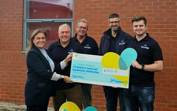 Staff at Shoothill IT present a cheque to Severn Hospice after their charity golf day event