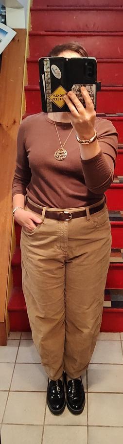 Chocolate brown long sleeve knit, camel barrel leg corduroys.  Chocolate suede belt. Gold jewelry, shiny black chunky loafers.