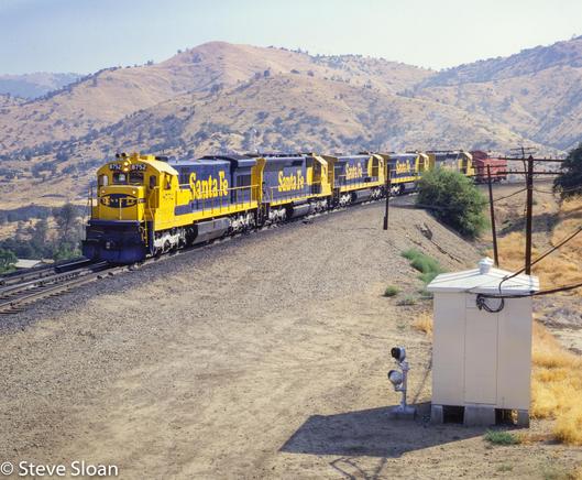 ATSF 8752 was leading a mix of EMD and GEs on a westbound cab hop at Walong, CA, on Saturday, June 19, 1982.