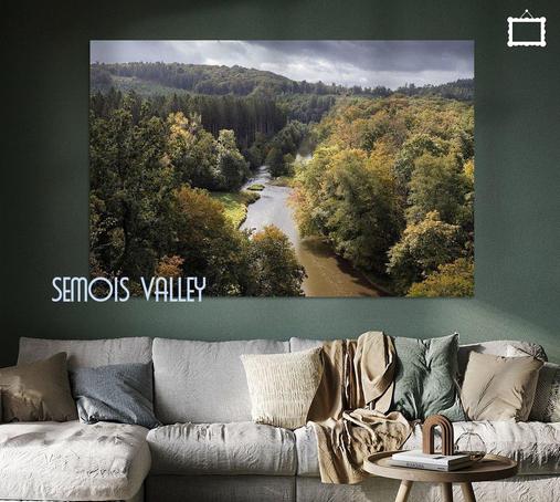 Beautiful view from the look out point at Squirrel Rock (La Roche l’Écureuil) captures the tranquil beauty of early autumn colours in the Ardennes Forest near Chiny, Wallonia, Belgium.