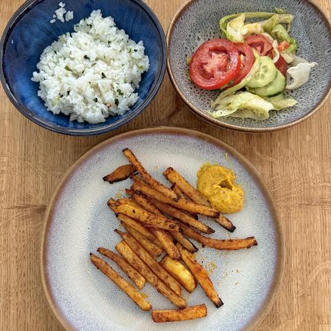 A close-up of my plate and bowls with the individual parts of the meal as described in the post.
