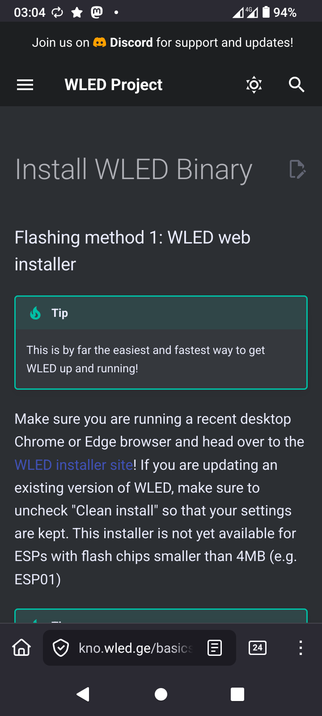 The image is a screenshot of a mobile device displaying a webpage from the WLED Project. The top of the screen shows the time as 03:04, a battery level of 94%, and a 4G signal. The webpage header includes a navigation bar with the text "WLED Project" and icons for menu, settings, and search. Below the header, the main content is titled "Install WLED Binary" with a subtitle "Flashing method 1: WLED web installer." A tip box highlights that this method is the easiest and fastest way to get WLED up and running. The text advises using a recent desktop Chrome or Edge browser and visiting the WLED installer site. It also mentions that for updates, uncheck "Clean install" to preserve settings. The installer is not available for ESPs with flash chips smaller than 4MB, such as ESP01. The bottom of the screen shows a browser address bar with the URL "kno.wled.ge/basics" and navigation icons.

Provided by @altbot, generated privately and locally using Ovis2-8B

🌱 Energy used: 0.245 Wh
