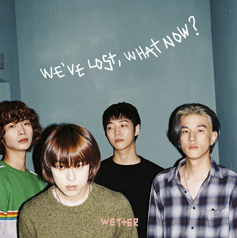 Four members of the Korean band Wetter with the text We've lost, what now? written above them