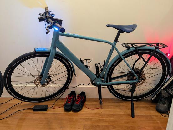 Photo of an Orbea Vibe ebike in a corridor, being charged.