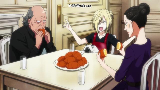 A cat sitting on the lap of a boy at a dining table