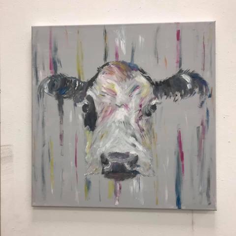 a cows head, modern painting on canvas. Behind stripes in blue red and yellow