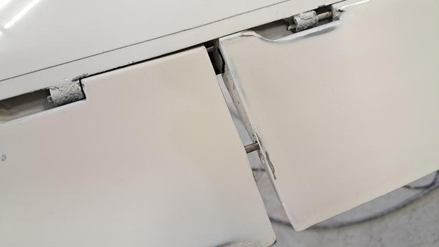 Joining the two flaperon halves. There are two pin/sockets that must be engaged as the two halves come together.