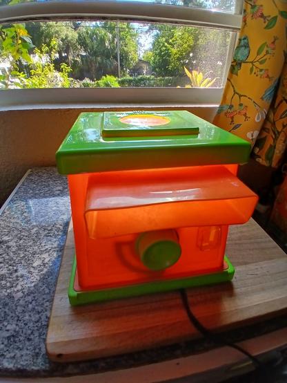 A creepy crawlers magic maker on a cutting board.
