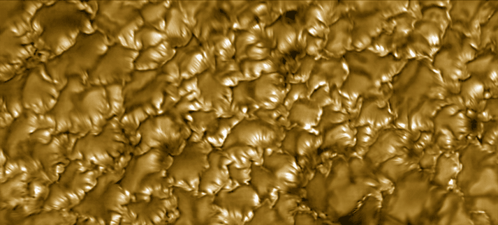 Colorized image of striations on the sun's photosphere.