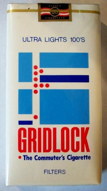 A package of Gridlock (The Commuter's Cigarette), showing a stylized aerial street view with little red dots representing either cars in a traffic jam or red blood cells in congested arteries.