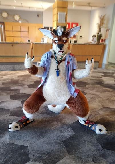A kangaroo Fursuiter standing in a Hotel Lobby.