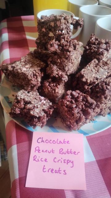 Close up of a plate of chocolate and peanut butter rice crispy cakes