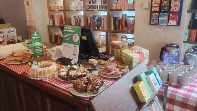 A table full of coffee cups and cakes