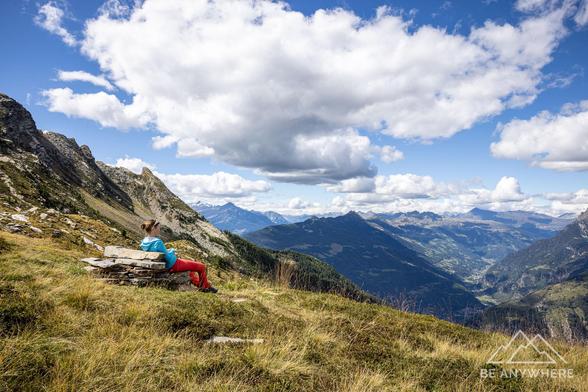 Woman resting with mountain views.