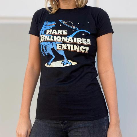 A woman wearing a shirt with a dinosaur and a planet on it that says "Make Billionaires Extinct".