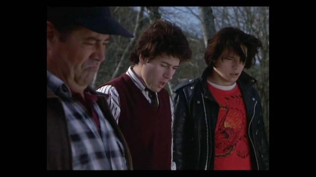 Screenshot from Northern Exposure.
Maurice, Joel and Ed are looking down, shocked, because a falling satellite hit Maggie's boyfriend.
(She already thought she's cursed and that's obviously not helping).