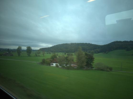 Shot of a misty hilly Allgäu landscape with house and some trees, taken out of a train #shotonLibrem5