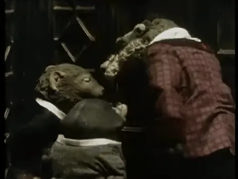 Moley, Ratty, and Badger turn to face the camera