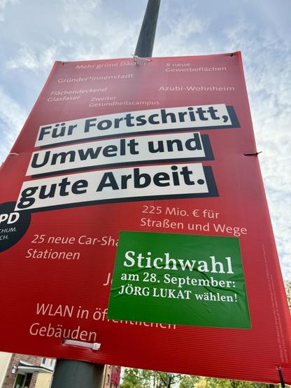 Wahlkampf der SPD Bochum-Ehrenfeld: SPD-Plakat mit zusätzlichem Hinweis zur Stichwahl für Jörg Lukat