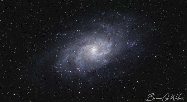 Triangulum galaxy captured through my monochrome camera. I captured about 3 hours each on the red, green, and blue filters and 4 hours on the luminance filter.