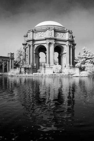 Palace Of Fine Arts Infrared II

This is an infrared photograph of the iconic Palace of Fine Arts in San Francisco.
The grand rotunda and classical columns of the Palace are prominently featured, showcasing its Beaux-Arts style.
The infrared technique transforms the surrounding foliage into ethereal, light-toned textures—often appearing white or silvery—creating a surreal contrast against the darker architectural elements.
A tranquil pond in the foreground mirrors the structure, adding depth and symmetry to the composition.
The overall mood is dreamlike and otherworldly, with the infrared palette lending a timeless, almost mystical quality to the scene.