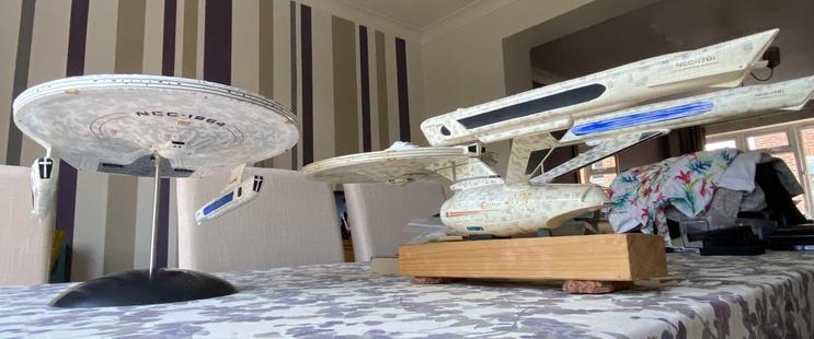 A different shot inspired from "The Wrath of Khan" that included both the Enterprise and Reliant. It is low(ish) down pointing slightly upwards. My Miranda-class model is to the left of the photo, and Dad's Constitution II-class from when he was a kid is on the right.