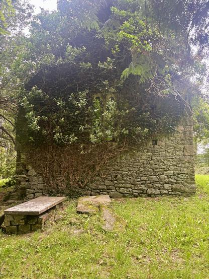 Remains of a grave at the foot of the tower at Llanmihangel Cowin.