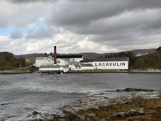 A view of Lagavulin distillery across Lagavulin bay on Islay island, Scotland