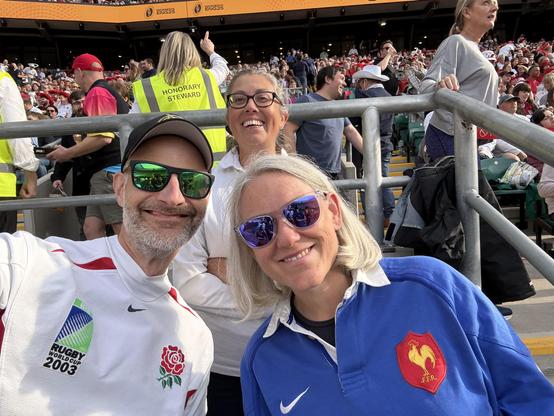 Me in my England shirt (2003) and my wife in her French shirt in the sunshine at twickenham.