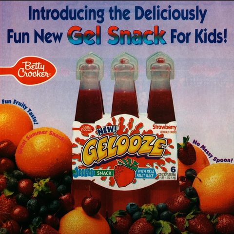 The advertisement shows a six pack of plastic squeezable juice with removable tops. On either side of the packaging are fruits to represent the fruit flavors that this packaging comes in.