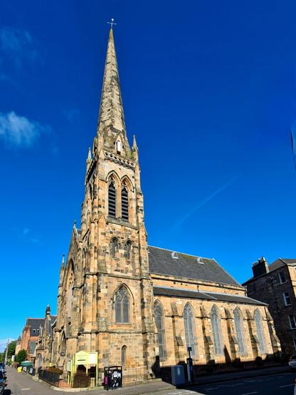 A blonde sandstone gothic style Victorian church.
