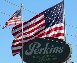 giant american flag outside a restaurant