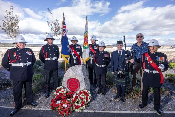 Ceremonial colour parade of firefighters at Alan Sherratt’s Red Plaque unveiling in Swansea, honouring his service and sacrifice.