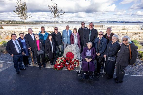 Community leaders and guests attend the Red Plaque ceremony in Swansea to honour fallen firefighter Alan Sherratt.