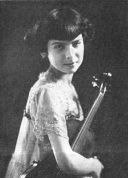 Sarah Kreindler, from a 1922 publication; a young white girl with dark hair cut in angled bangs, holding a violin