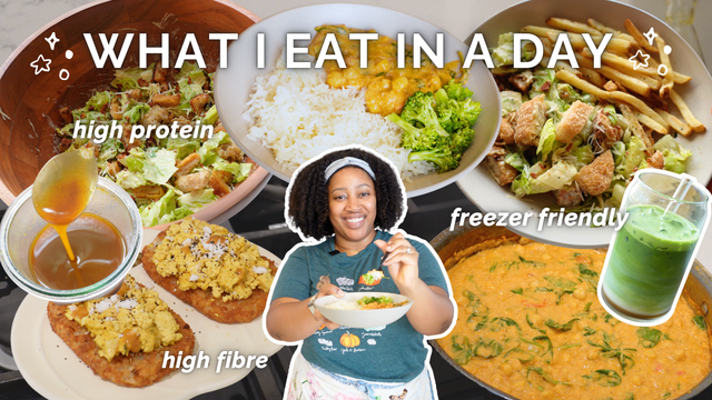 YouTube thumbnail titled “What I Eat in a Day” with a woman in the center holding a bowl of food, smiling against a collage of vibrant, plant-based dishes. Surrounding her are images of high-protein Caesar salad, a bowl of curry with rice and broccoli, a Caesar salad with fries, pumpkin spice iced matcha drink, coconut chickpea cirry, hash browns topped with tofu scramble, and a jar of pumpkin spice syrup. Overlayed text highlights “high protein,” “freezer friendly,” and “high fibre". There are star doodles and white cutout outlines framing key elements.