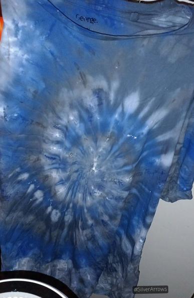 The t-shirt opened up and hung up to dry. The spiral pattern is clear and the colours show up well.