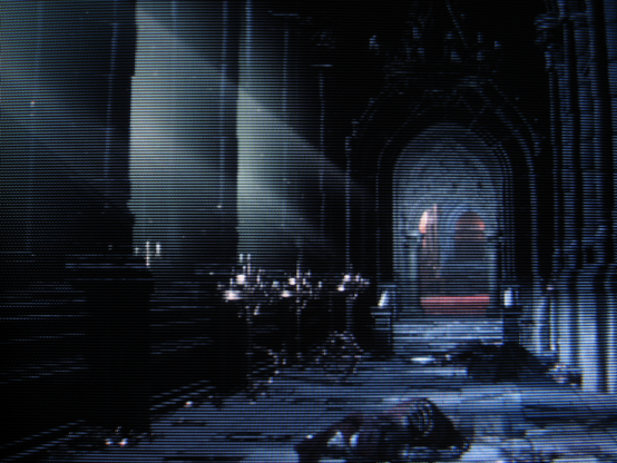 The once-mighty Lothric Castle persists, diminished, lingering. Dust motes swim in pale, penetrating light like memories of yore.