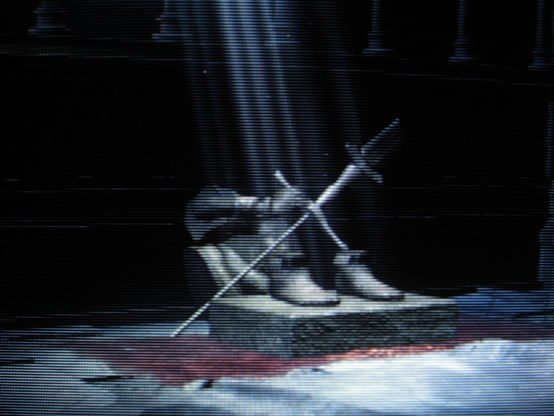 A crumbled statue secreted away conjures a fleeting memory of jovial partnership with canny comrades.