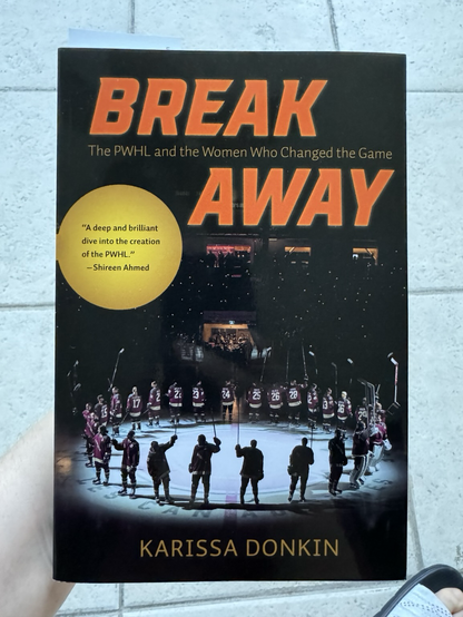 The cover of a book, “Breakaway: The PWHL and the Women Who Changed the Game.”
