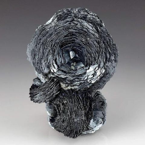 Metallic hematite crystals forming rose shaped from Huanggang Mines, Keshiketeng Co., Chifeng, Inner Mongolia. From: https://www.geologyin.com/2024/01/hematite-properties-uses-meaning.html