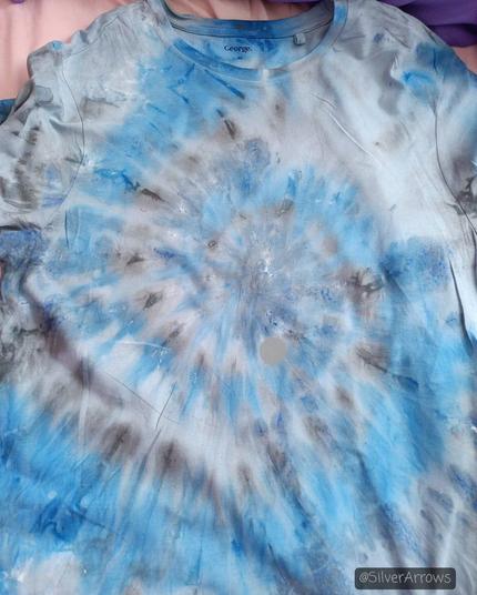 The front of the tshirt after drying. The spiral pattern is still visible, but the white barely shows