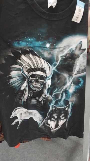 Basically a three wolf moon shirt but with a skeleton wearing a chieftain headdress
