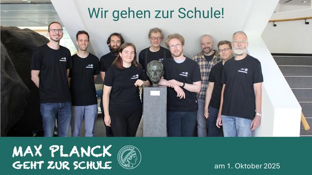 Group picture of nine scientists dressed in a black MPS T-shirt gathered around a statue of Max Planck in the foyer of the MPS