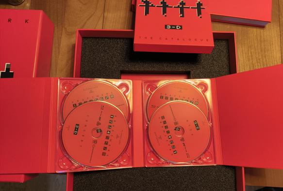 Kraftwerk The Catalogue 3-D, box set, blu-ray release, view of the opened box with book and blurays visible